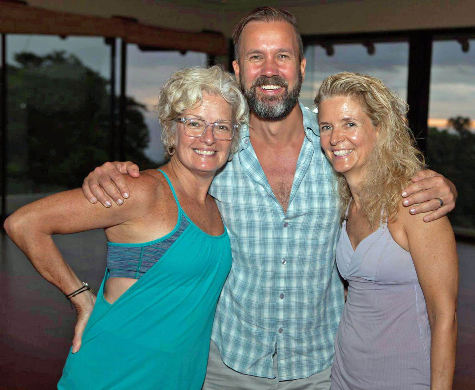 Roxane with her sister Renee and Ted Grand, co-founder Moksha Yoga Int'l